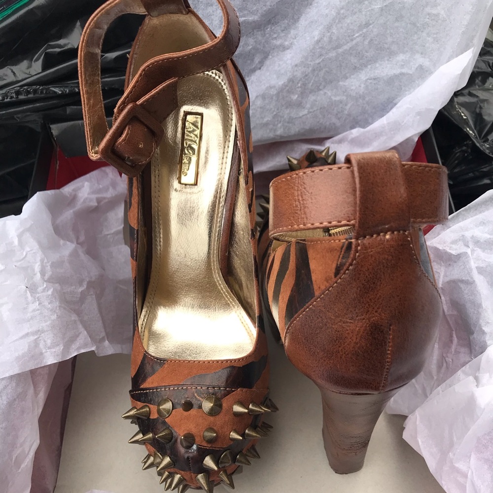 Wild pair spiked heels with ankle strap